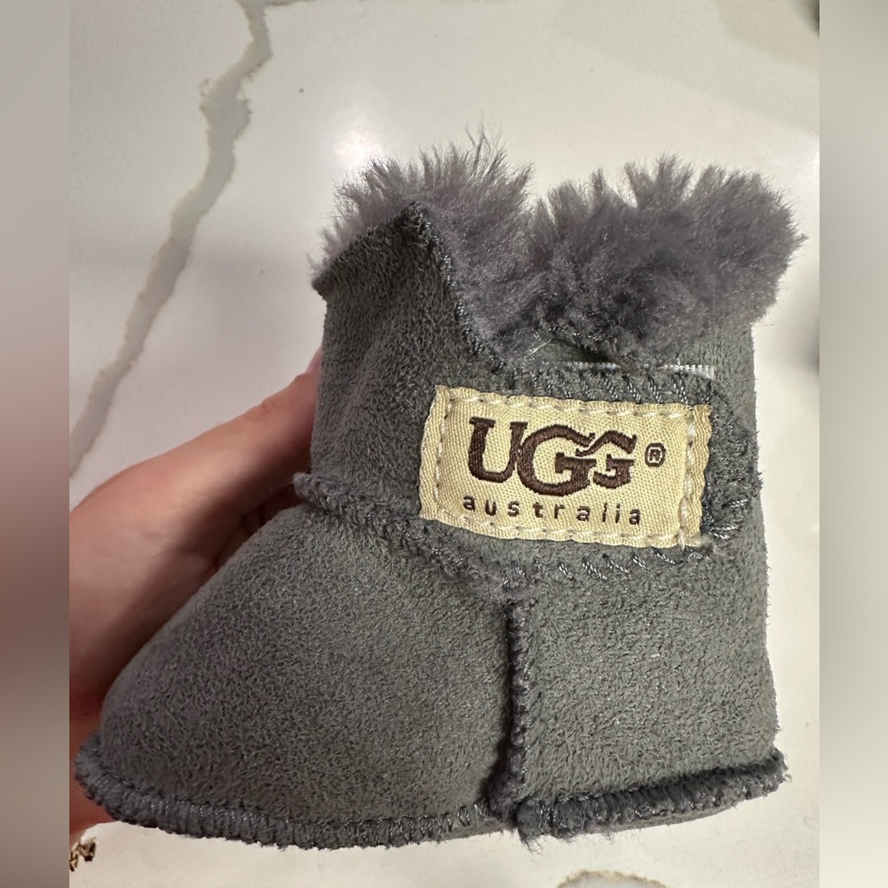 UGG Infant Booties 
Never worn 
Size 2-3 (6-12 month)
